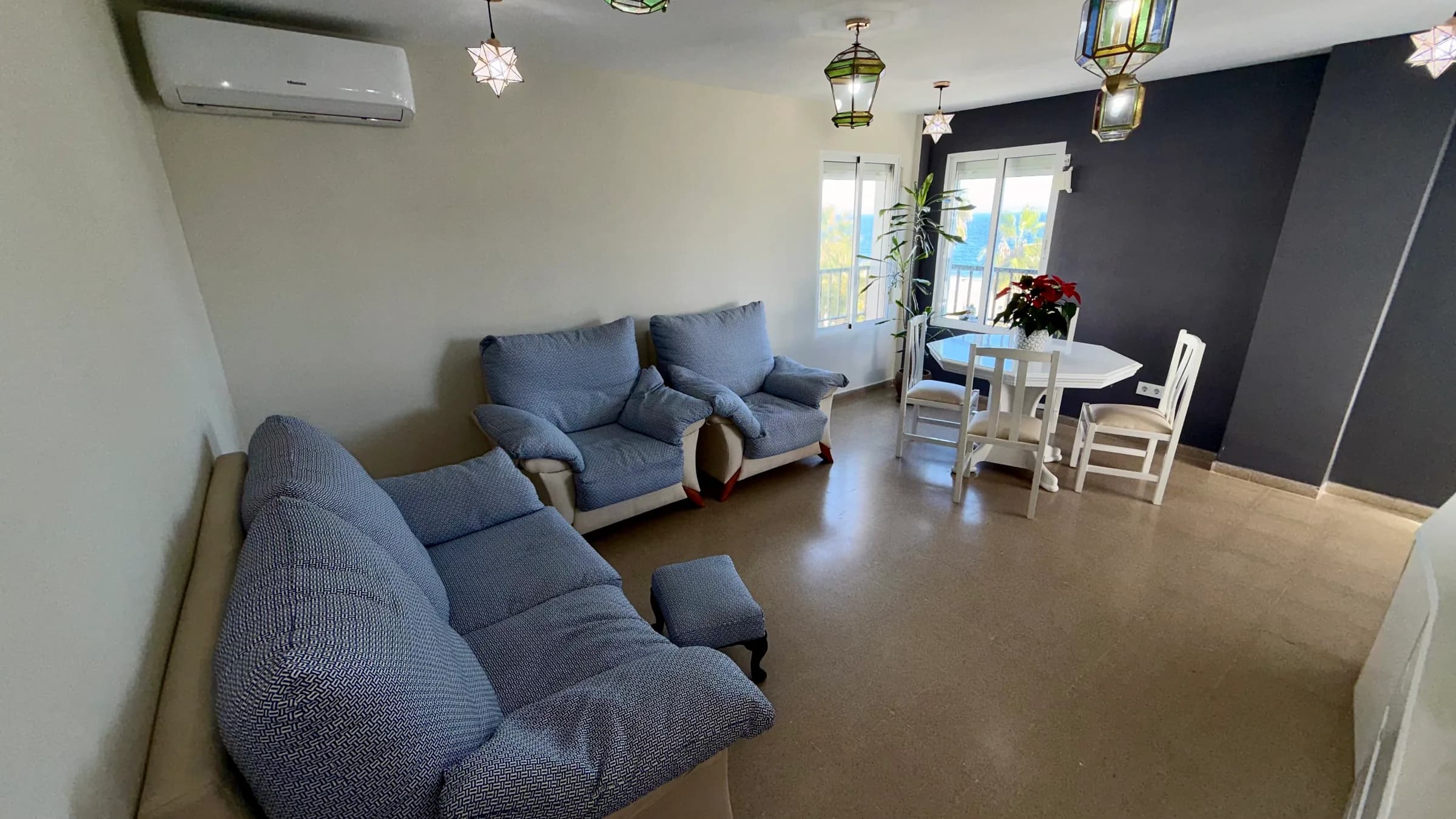Open-plan living room with sofa seating and dining area