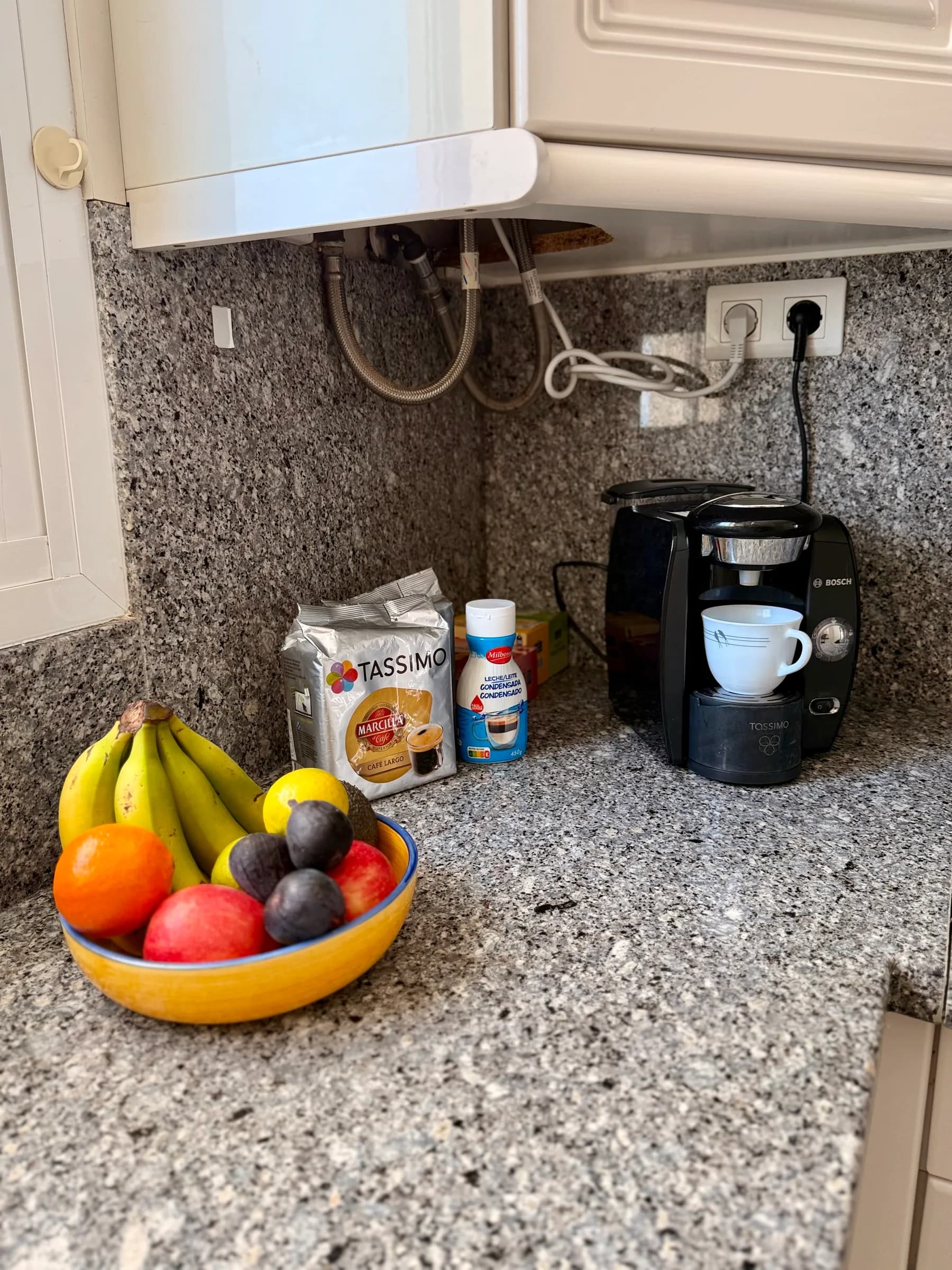Kitchen with breakfast bar and coffee machine
